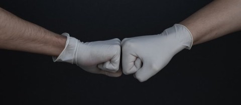 Photo of doctor fist bump by Branimir Balogović on Unsplash