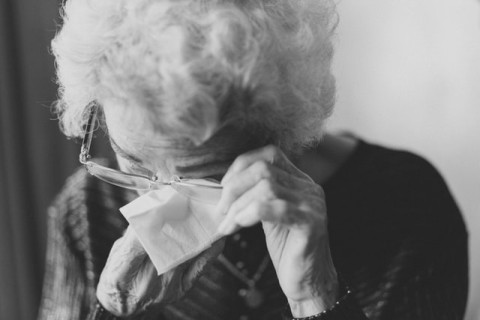 Photo of elderly woman crying by Jeremy Wong (Unsplash) 