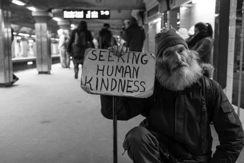 Homeless man seeking human kindness by Matt Collamer on Unsplash