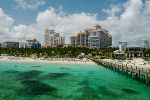 Image of buildings along tropical shoreline 