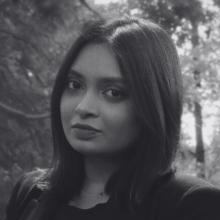 A black and white headshot of Zaima Aurony